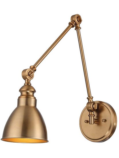 Dakota Adjustable Wall Sconce in Warm Brass.